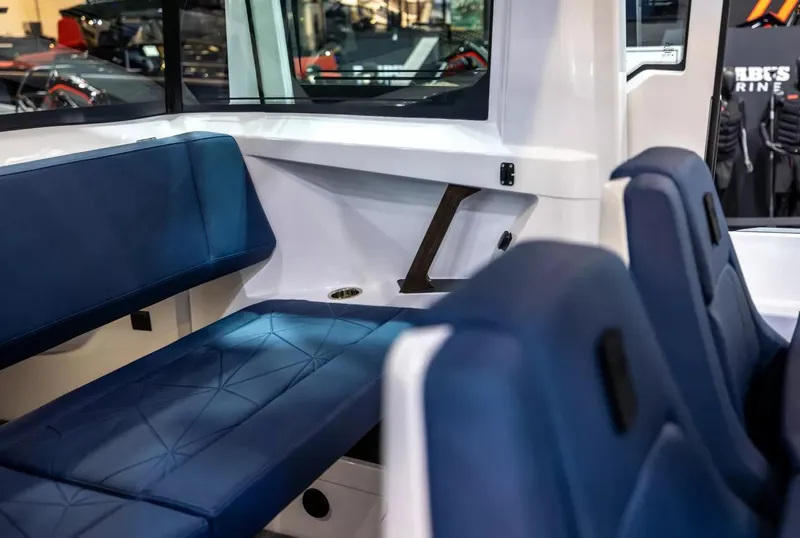 Slide: The Image of 2026 Axopar 29 XC Cross Cabin interior with modern seating and advanced dashboard. - 9