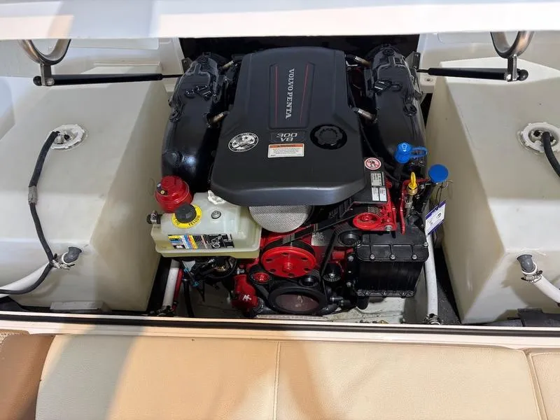 Slide: The Image of Engine compartment of a 2019 Cobalt CS23 Surf boat, featuring a Volvo Penta engine. - 10