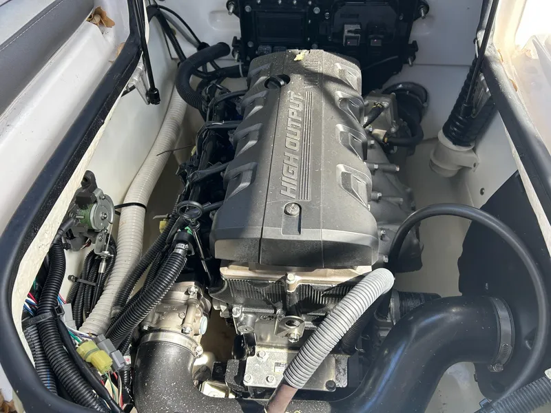 Slide: The Image of 2022 Yamaha Boats SX190 engine compartment showcasing detailed components and wiring. - 15