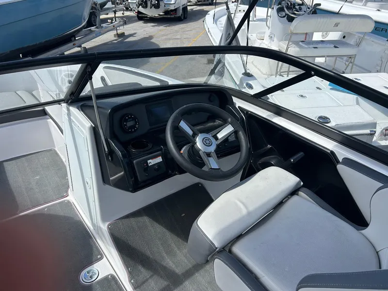 Slide: The Image of 2022 Yamaha Boats SX190 cockpit with steering wheel and dashboard, featuring modern design elements. - 6