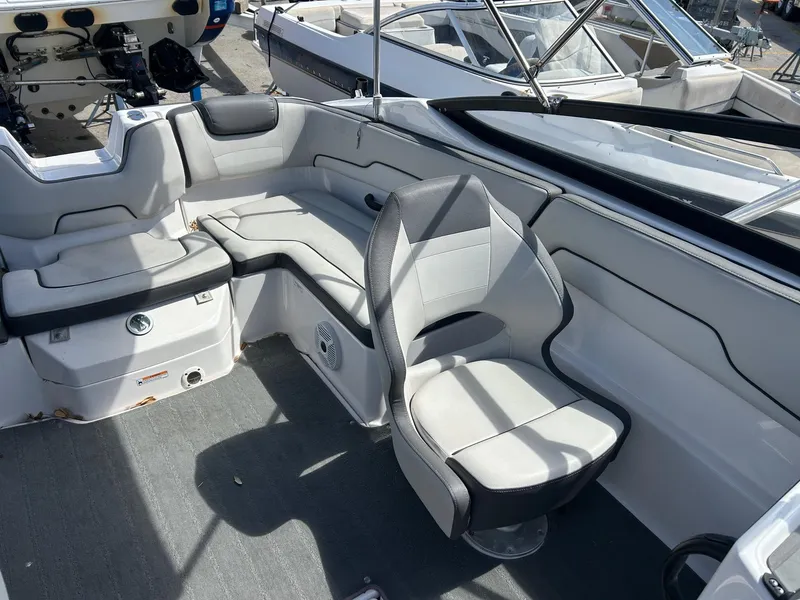 Slide: The Image of 2022 Yamaha Boats SX190 interior with gray seating and modern design. - 9