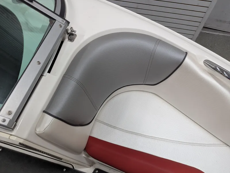 Slide: The Image of 2012 MasterCraft X-14 boat interior with gray and red upholstery detail. - 13