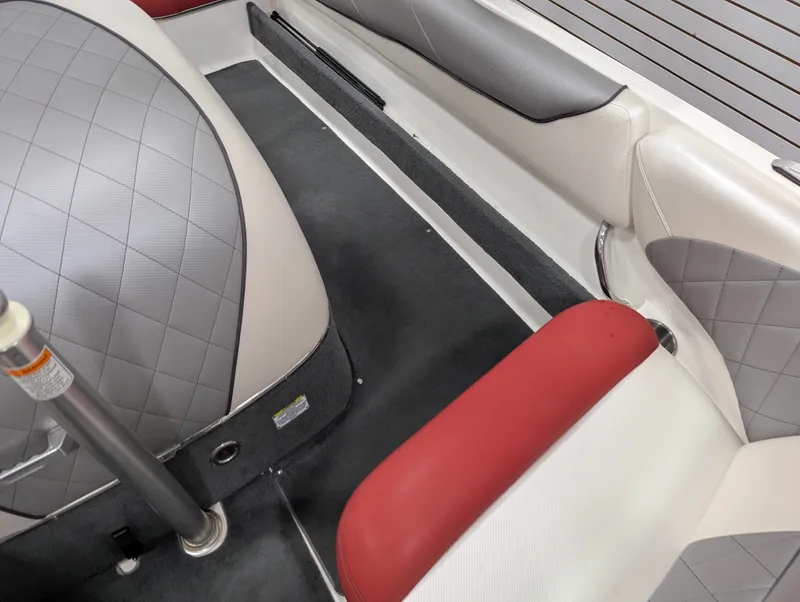 Slide: The Image of Interior of a 2012 MasterCraft X-14 boat with red and gray seating. - 18