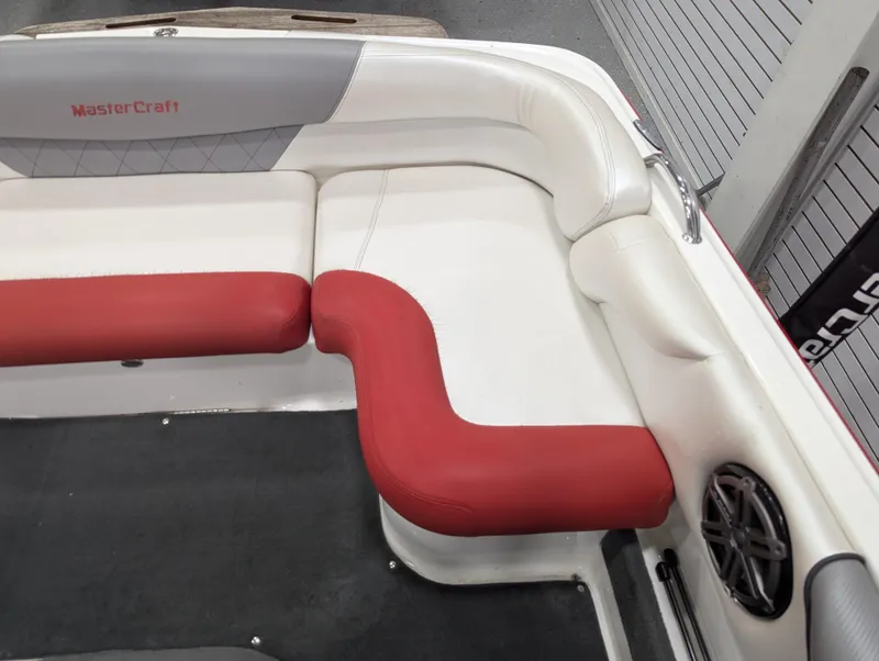 Slide: The Image of 2012 MasterCraft X-14 boat interior with red and white seating. - 20