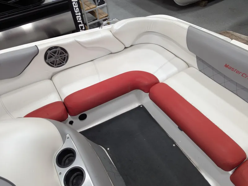Slide: The Image of 2012 MasterCraft X-14 boat interior with red and white seating and speaker system. - 21