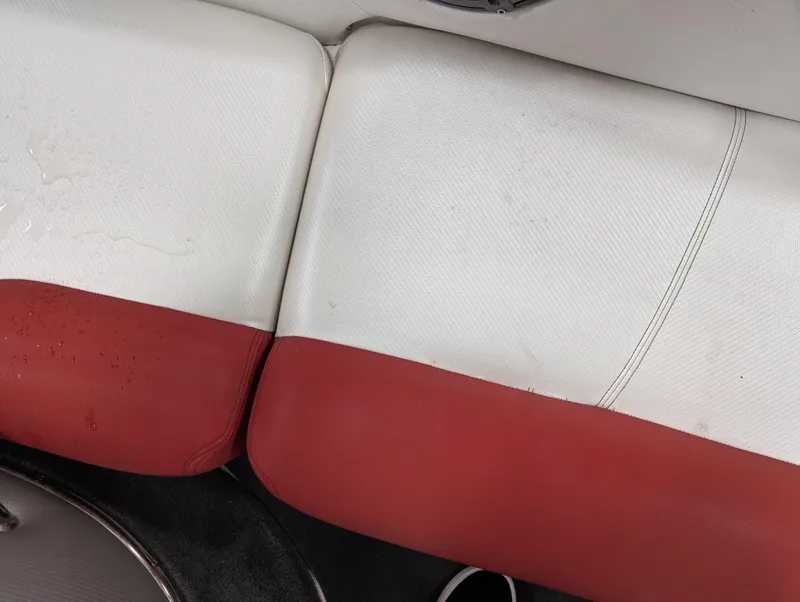 Slide: The Image of Red and white seating in a 2012 MasterCraft X-14 boat. - 26