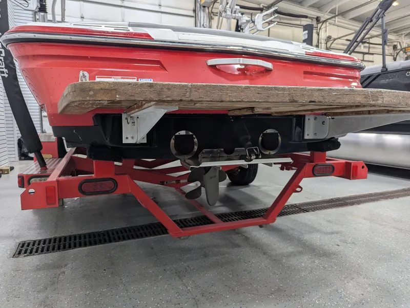 Slide: The Image of 2012 MasterCraft X-14 boat on trailer, rear view in a garage setting. - 29