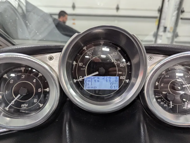 Slide: The Image of Dashboard of a 2012 MasterCraft X-14 boat showing gauges and digital display. - 8