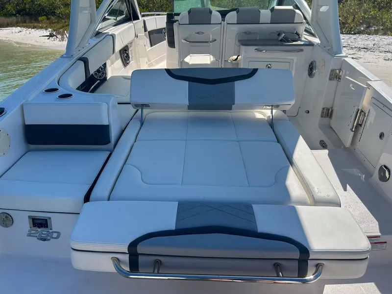 Slide: The Image of 2024 Chaparral 280 OSX boat interior with luxurious seating and modern design. - 13