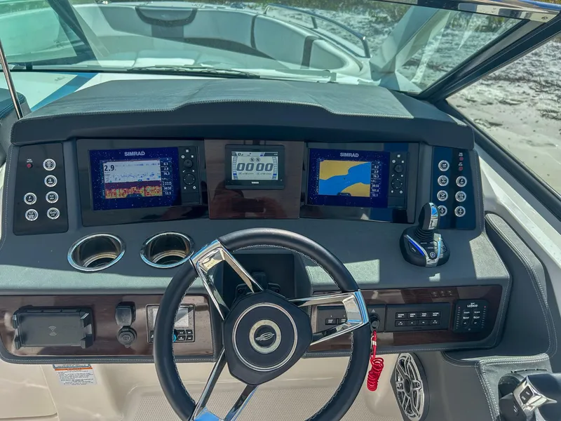 Slide: The Image of 2024 Chaparral 280 OSX dashboard with advanced navigation and control systems. - 14