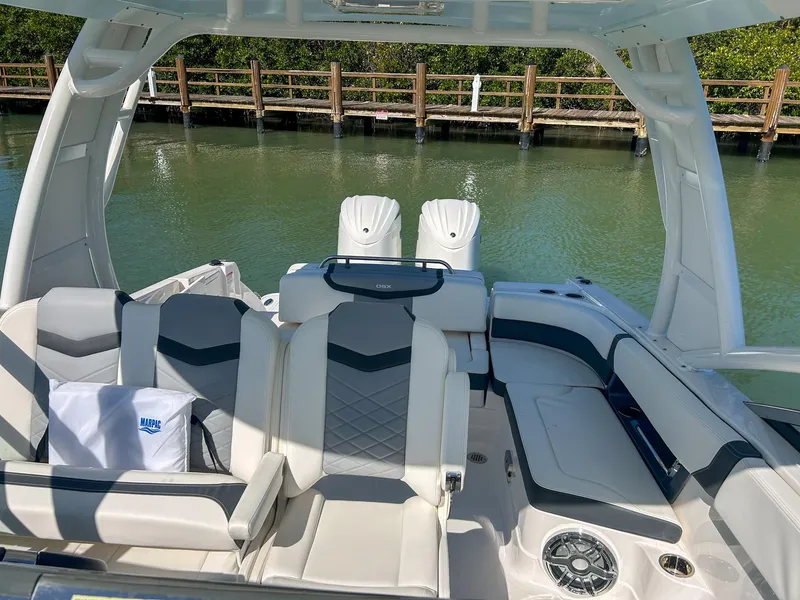 Slide: The Image of 2024 Chaparral 280 OSX boat interior with luxurious seating and modern design. - 7