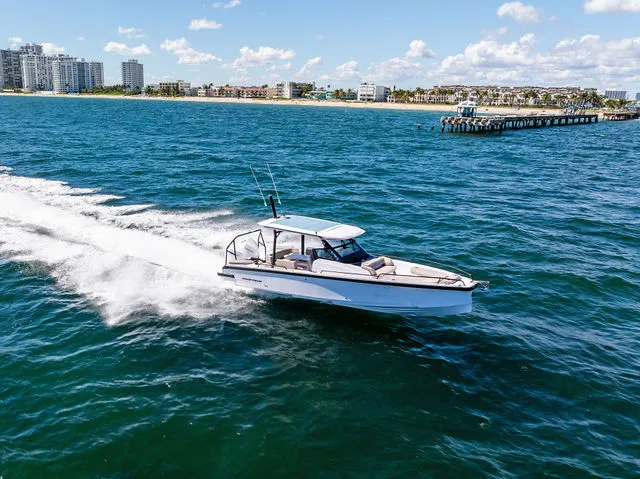 Slide: The Image of 2026 Axopar 29 Sun-Top boat cruising on open water. - 29