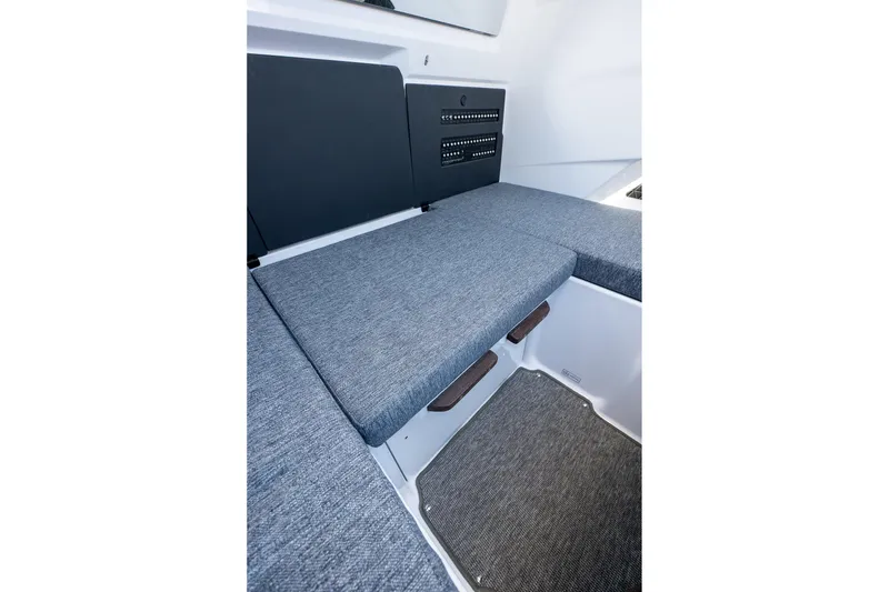 Slide: The Image of Interior seating area of 2026 Axopar 29 Sun-Top boat with gray cushions. - 43