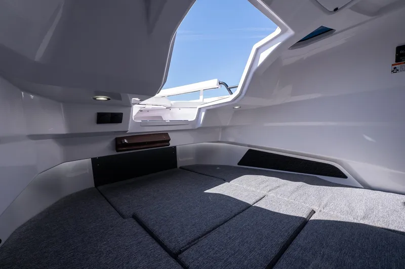 Slide: The Image of Interior cabin of 2026 Axopar 29 Sun-Top boat, featuring sleek design and comfortable seating. - 45
