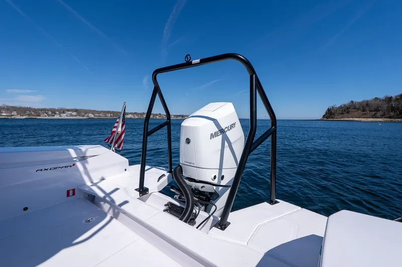 Slide: The Image of 2026 Axopar 29 Sun-Top boat with Mercury engine on open water. - 52