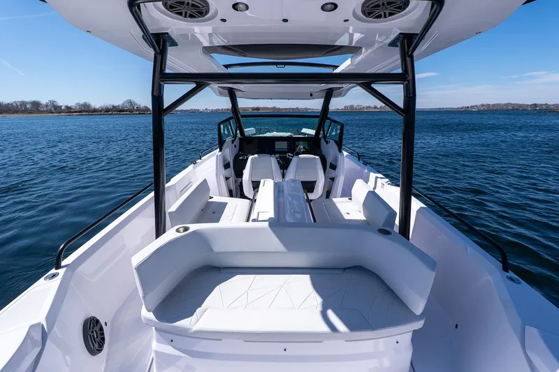 Slide: The Image of 2026 Axopar 29 Sun-Top boat interior with sleek seating and open water view. - 57