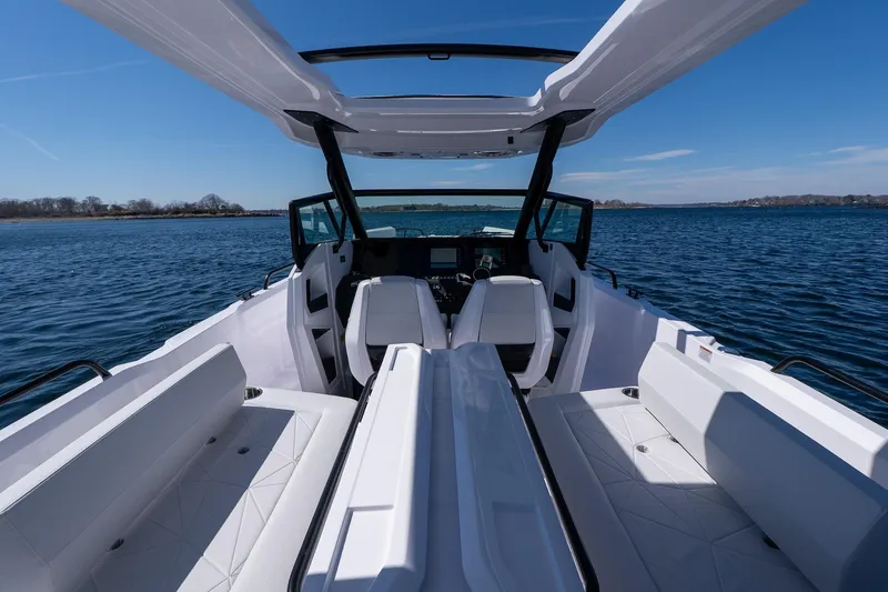 Slide: The Image of 2026 Axopar 29 Sun-Top boat interior with sleek seating and open water view. - 58