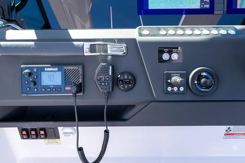 Slide: The Image of Control panel of 2026 Axopar 29 Sun-Top boat with Simrad electronics. - 62