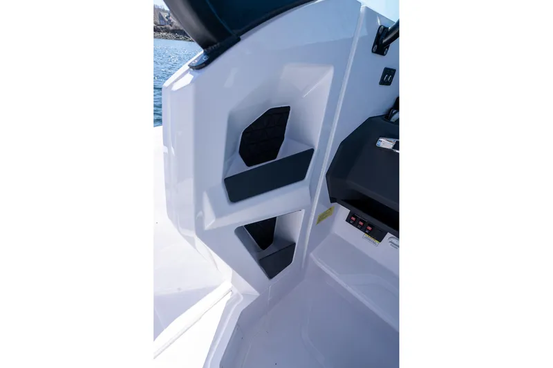 Slide: The Image of Interior detail of 2026 Axopar 29 Sun-Top boat, featuring sleek storage compartments. - 64