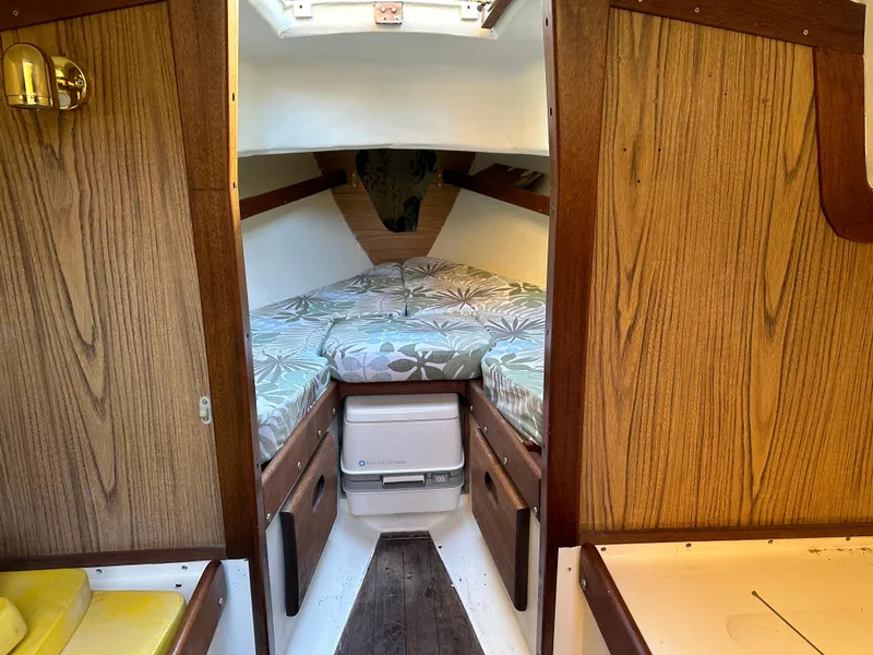 Slide: The Image of Interior of 1968 Allied Greenwich 24 sailboat with cozy cabin and wooden paneling. - 12
