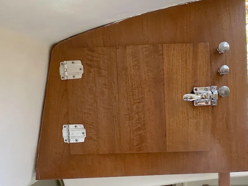 Slide: The Image of Wooden hatch door with metal hinges and latch on Allied Greenwich 24, 1968 model. - 16