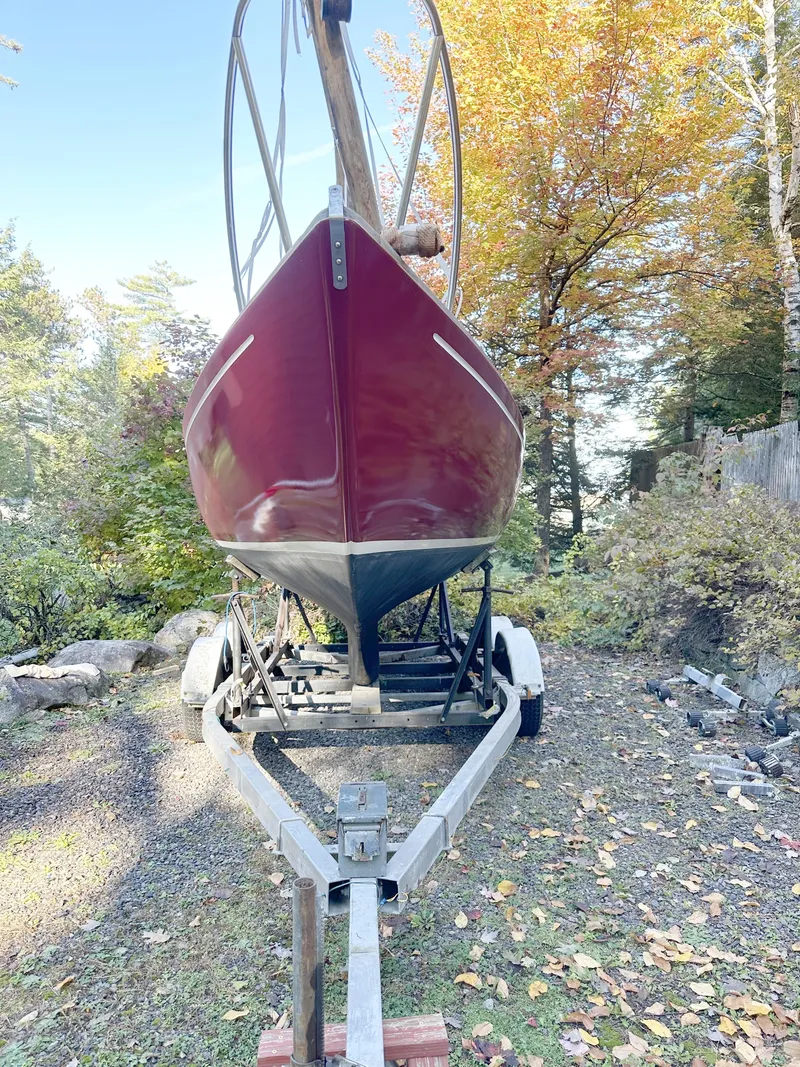 Slide: The Image of 1968 Allied Greenwich 24 sailboat on trailer, surrounded by autumn foliage. - 18