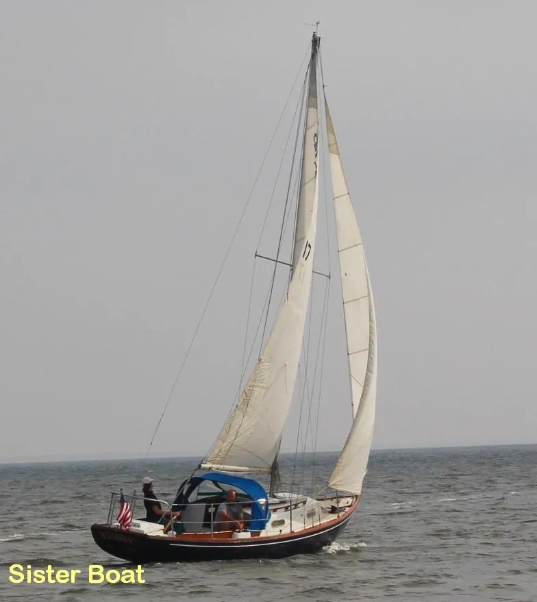Slide: The Image of 1968 Allied Greenwich 24 sailboat navigating open waters under full sail. - 21