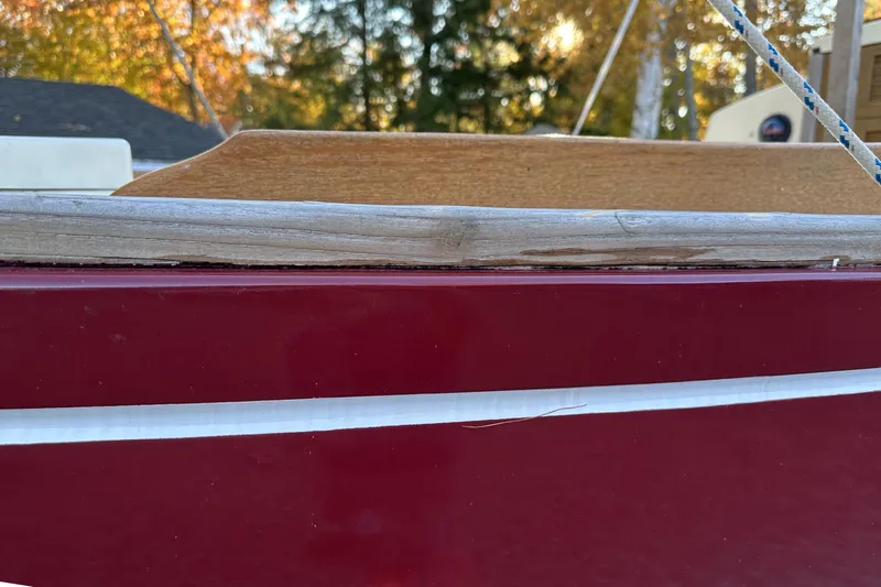 Slide: The Image of Red hull of 1968 Allied Greenwich 24 sailboat with wooden trim detail. - 4