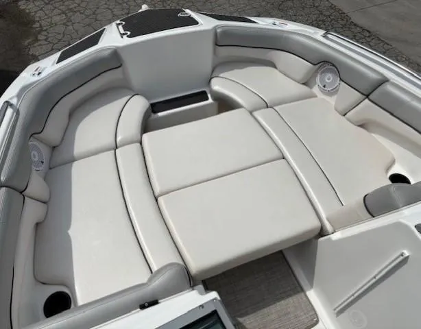 Slide: The Image of 2012 Yamaha Boats AR210 interior with cushioned seating and speakers. - 12