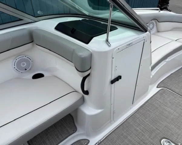 Slide: The Image of 2012 Yamaha AR210 boat interior with white seating and storage compartment. - 16