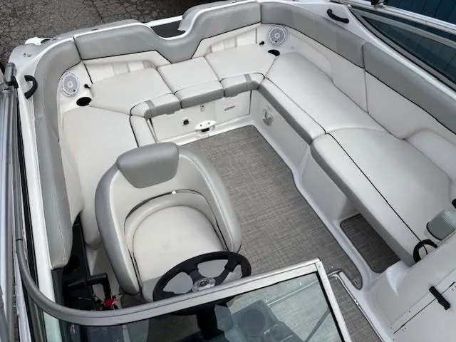 Slide: The Image of 2012 Yamaha AR210 boat interior with white seating and steering wheel. - 18