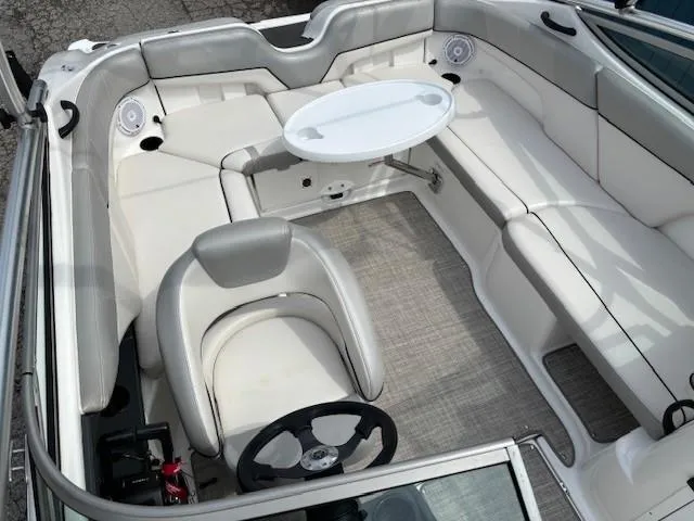 Slide: The Image of 2012 Yamaha AR210 boat interior with white seating and a central table. - 19