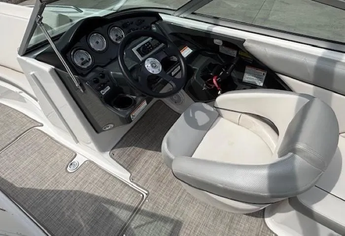 Slide: The Image of 2012 Yamaha AR210 boat cockpit with steering wheel and gauges. - 20
