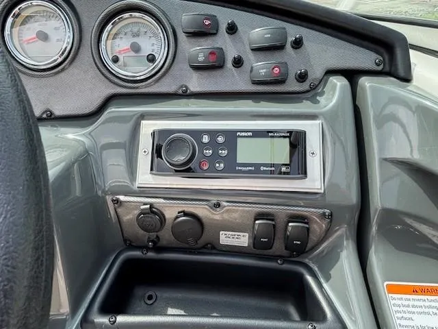 Slide: The Image of Dashboard of 2012 Yamaha AR210 boat with gauges and control panel. - 25