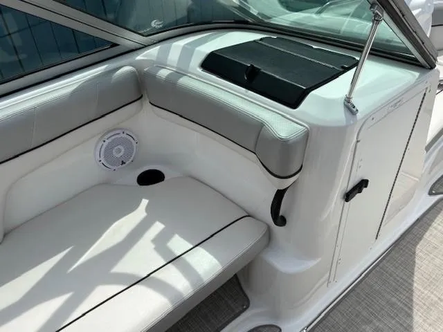Slide: The Image of 2012 Yamaha AR210 boat interior with white seating and speaker. - 26