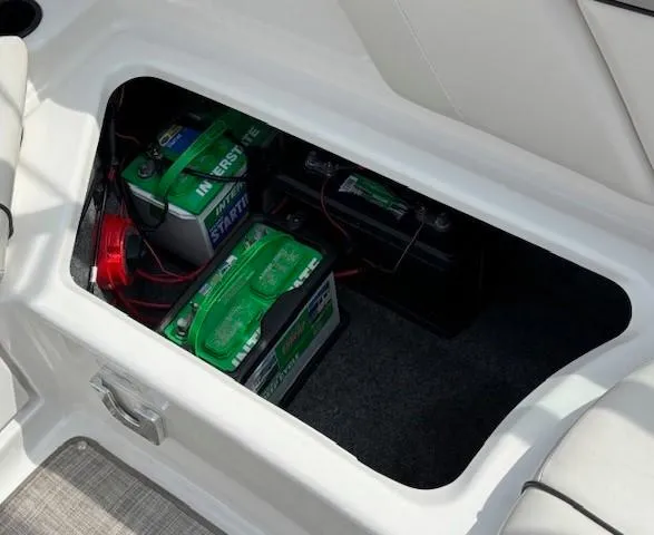 Slide: The Image of Battery compartment of a 2012 Yamaha AR210 boat, featuring Interstate batteries. - 28