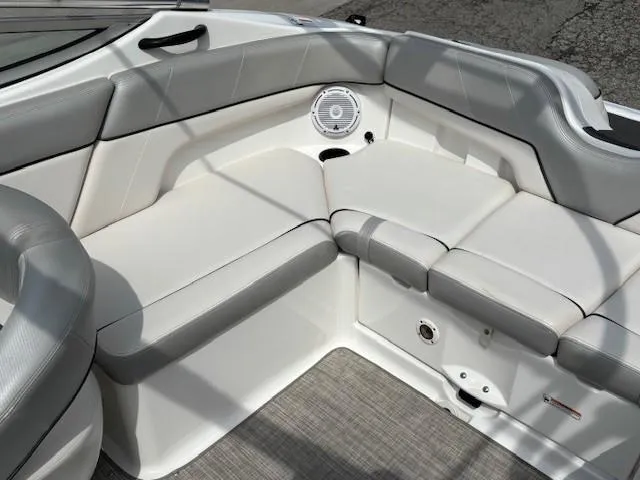 Slide: The Image of 2012 Yamaha AR210 boat interior with gray and white seating and speaker. - 29