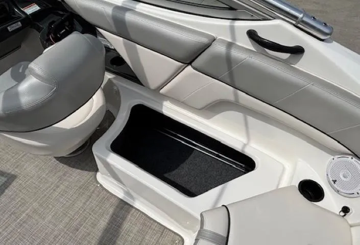 Slide: The Image of 2012 Yamaha AR210 boat interior with seating and storage compartment. - 30