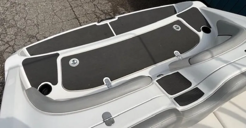 Slide: The Image of 2012 Yamaha Boats AR210 swim platform with black and white design. - 34