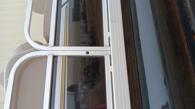 Slide: The Image of 2022 Ranger 200F boat with sleek design and aluminum railing. - 19