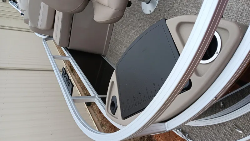 Slide: The Image of 2022 Ranger 200F boat interior with seating and railing, showcasing modern design. - 22