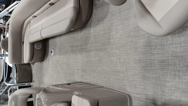 Slide: The Image of Interior of a 2022 Ranger 200F boat with beige seating and carpet flooring. - 3