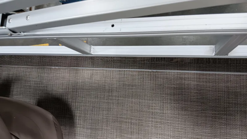 Slide: The Image of 2022 Ranger 200F boat interior with metal frame and carpeted floor. - 5