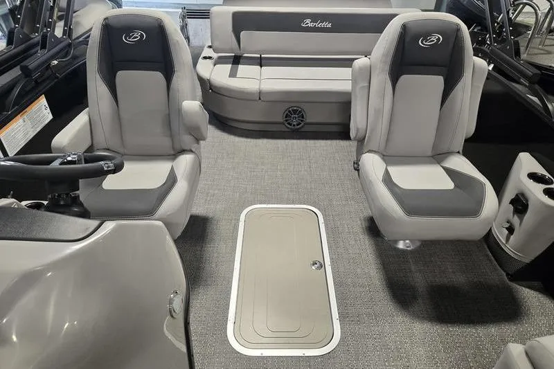 Slide: The Image of 2025 Barletta A22UC boat interior with gray seating and carpeted flooring. - 11