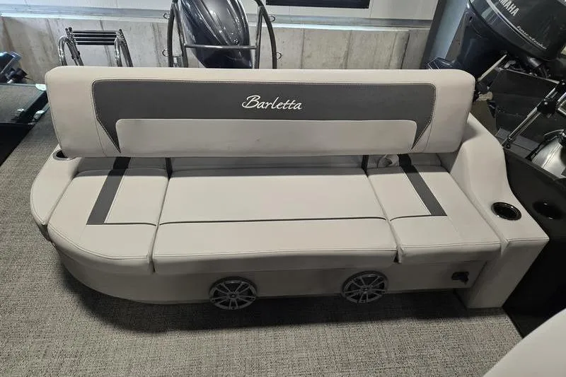 Slide: The Image of 2025 Barletta A22UC boat seat with integrated speakers and cup holder. - 12