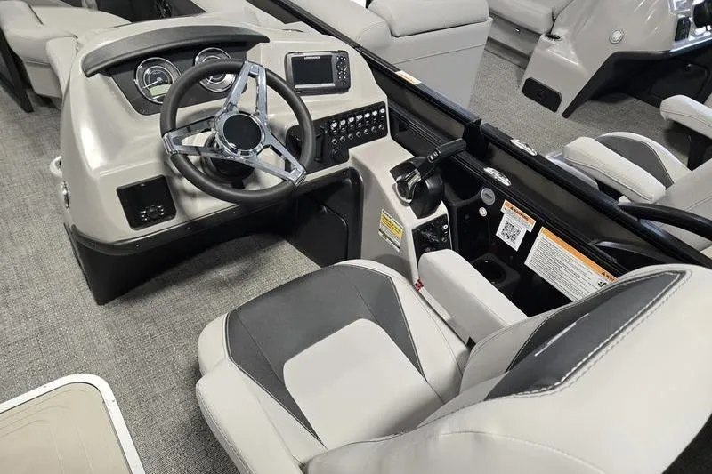 Slide: The Image of 2025 Barletta A22UC boat interior with modern dashboard and steering wheel. - 13