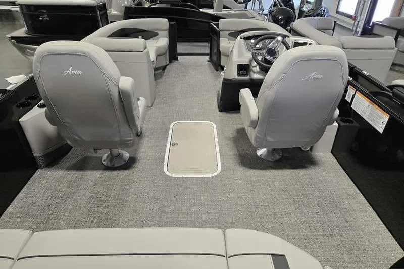 Slide: The Image of 2025 Barletta A22UC boat interior with gray seating and modern helm design. - 4