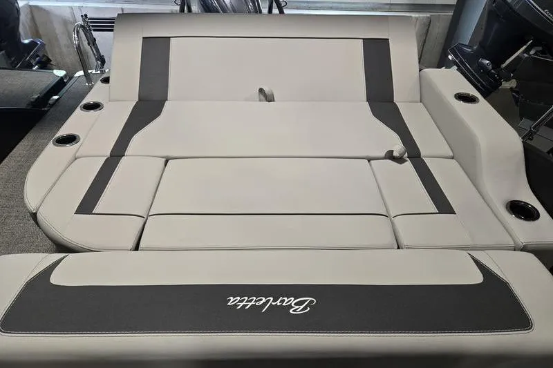 Slide: The Image of 2025 Barletta A22UC boat interior with luxurious seating and cup holders. - 8