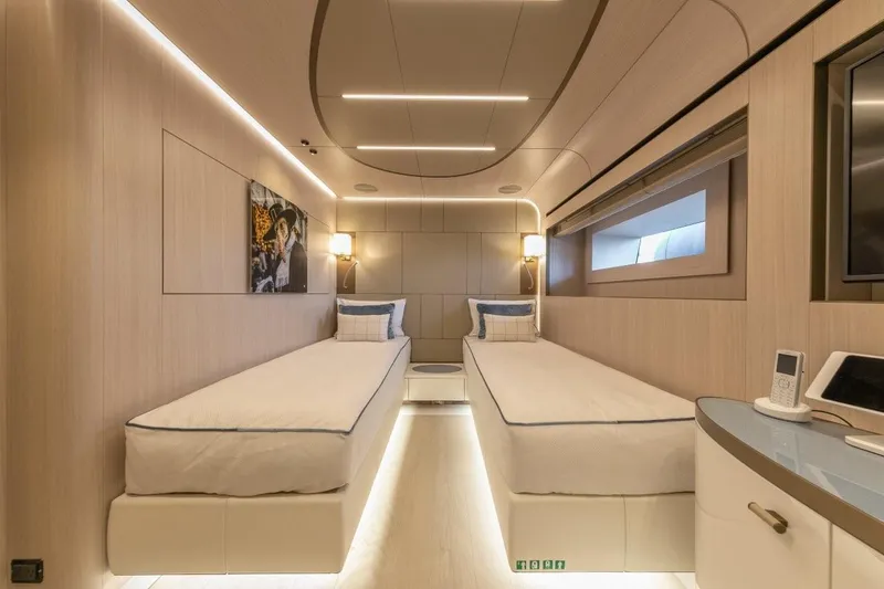 Slide: The Image of Luxurious twin cabin interior on 2020 Rossinavi Custom yacht, featuring modern design and ambient lighting. - 14