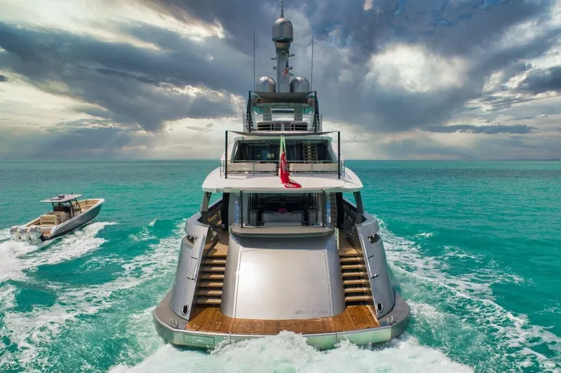 Slide: The Image of Luxurious 2020 Rossinavi Custom yacht cruising in turquoise waters under dramatic skies. - 4